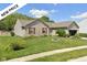 Charming single-story home with a well-manicured front yard and delightful curb appeal, featuring flower-filled window boxes at 6540 Avalon Blvd, Avon, IN 46123