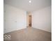 Bedroom featuring carpet and a closet at 6636 Sulgrove Pl, Indianapolis, IN 46221