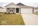 Charming single-story home with a two-car garage, well-manicured lawn, and attractive curb appeal at 6636 Sulgrove Pl, Indianapolis, IN 46221