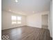 A spacious living room with lots of light and windows overlooking a nice yard at 6636 Sulgrove Pl, Indianapolis, IN 46221