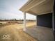 Covered patio provides an outdoor space for relaxation and entertainment with a view of the landscaped backyard at 6636 Sulgrove Pl, Indianapolis, IN 46221