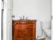 Small bathroom with dark wood vanity and updated toilet at 704 S Ohio St, Sheridan, IN 46069
