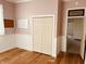 Bedroom with hardwood floors, wainscoting detail, and neutral paint, offering a cozy, blank canvas at 704 S Ohio St, Sheridan, IN 46069