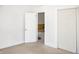 Simple bedroom with neutral walls and carpet, offering versatile space at 704 S Ohio St, Sheridan, IN 46069