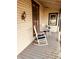 Relaxing front porch with rocking chairs, offering a peaceful outdoor space at 704 S Ohio St, Sheridan, IN 46069
