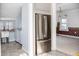 Stainless steel refrigerator and adjacent laundry area at 704 S Ohio St, Sheridan, IN 46069