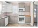 Updated kitchen featuring granite countertops and modern appliances at 704 S Ohio St, Sheridan, IN 46069