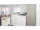 Stackable Samsung washer and dryer in a well-lit laundry room at 704 S Ohio St, Sheridan, IN 46069