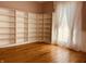 Inviting room with large built-in shelves and natural light streaming through the window at 704 S Ohio St, Sheridan, IN 46069