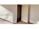 Bright room with white walls, carpet, and natural light coming through a doorway, creating a blank canvas at 704 S Ohio St, Sheridan, IN 46069