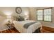 Cozy bedroom with hardwood floors and a large window at 8104 Pocket Hollow Ct, Indianapolis, IN 46256