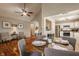 Open concept dining area with wood floors, modern furnishings, and easy access to the kitchen at 8104 Pocket Hollow Ct, Indianapolis, IN 46256