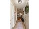 Inviting foyer with tile flooring and view into the living room featuring a fireplace at 8104 Pocket Hollow Ct, Indianapolis, IN 46256