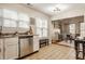 Well-lit kitchen with stainless steel appliances flows into cozy dining area, perfect for modern living at 8104 Pocket Hollow Ct, Indianapolis, IN 46256