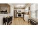 Bright kitchen featuring stainless steel appliances, white cabinets, and tile flooring at 8104 Pocket Hollow Ct, Indianapolis, IN 46256