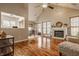 Bright living room with hardwood floors, vaulted ceiling, fireplace and dining space at 8104 Pocket Hollow Ct, Indianapolis, IN 46256