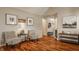 Open living area featuring hardwood floors, neutral walls, and stylish decor at 8104 Pocket Hollow Ct, Indianapolis, IN 46256
