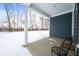 Relaxing back porch with metal chairs and snowy backyard view at 829 Stark St, Greenfield, IN 46140
