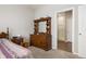 Bright bedroom with dresser and ensuite bathroom access at 829 Stark St, Greenfield, IN 46140