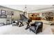 Finished basement features a game room with foosball, bar, and seating at 8526 Oakmont Ln, Indianapolis, IN 46260
