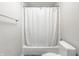 Simple bathroom with a shower/tub combo and white fixtures at 8526 Oakmont Ln, Indianapolis, IN 46260
