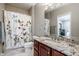 Bathroom with granite countertop, spacious vanity, and shower/tub combo at 8526 Oakmont Ln, Indianapolis, IN 46260