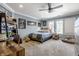 Spacious bedroom with carpeted floor, built-in shelves, and a comfortable bed at 8526 Oakmont Ln, Indianapolis, IN 46260