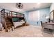 Charming bedroom with built-in bunk beds, a desk, and ample storage at 8526 Oakmont Ln, Indianapolis, IN 46260