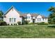 Large two-story house with light-colored brick and landscaping at 8526 Oakmont Ln, Indianapolis, IN 46260
