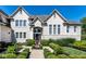 Landscaped front yard with walkway leading to the house entrance at 8526 Oakmont Ln, Indianapolis, IN 46260