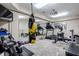 Well-equipped home gym featuring treadmill, weights, and punching bag at 8526 Oakmont Ln, Indianapolis, IN 46260