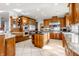 Modern kitchen with large island, stainless steel appliances, and wood cabinetry at 8526 Oakmont Ln, Indianapolis, IN 46260