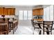 Eat-in kitchen with wood cabinets, granite countertops, and stainless steel appliances at 8526 Oakmont Ln, Indianapolis, IN 46260