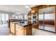 Island kitchen with granite countertops, stainless steel appliances, and wood cabinets at 8526 Oakmont Ln, Indianapolis, IN 46260