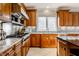 Spacious kitchen with granite countertops, stainless steel appliances, and wood cabinetry at 8526 Oakmont Ln, Indianapolis, IN 46260