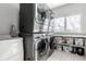Laundry room with stacked washer and dryer and storage shelves at 8526 Oakmont Ln, Indianapolis, IN 46260