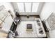 High-angle view of spacious living room with hardwood floors, comfortable seating, and large windows at 8526 Oakmont Ln, Indianapolis, IN 46260