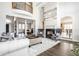 Two-story living room with hardwood floors, fireplace, and high ceilings at 8526 Oakmont Ln, Indianapolis, IN 46260