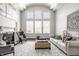 Spacious living room with high ceilings, large windows, and fireplace at 8526 Oakmont Ln, Indianapolis, IN 46260