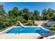 Inviting inground pool with a slide and ample deck space at 8526 Oakmont Ln, Indianapolis, IN 46260