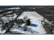 Aerial view of house with large lot and surrounding fields at 868 N Raceway Rd, Indianapolis, IN 46234