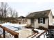 Snowy backyard with shed, pergola, and partially covered pool at 868 N Raceway Rd, Indianapolis, IN 46234