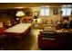 Finished basement with pool table and comfortable seating at 868 N Raceway Rd, Indianapolis, IN 46234