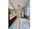 Elegant bathroom with double vanity, jetted tub, and separate shower at 868 N Raceway Rd, Indianapolis, IN 46234