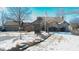 Brick house with attached two-car garage, landscaping, and a flagpole in the front yard at 868 N Raceway Rd, Indianapolis, IN 46234