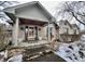 Brick front porch with columns and stone flooring at 868 N Raceway Rd, Indianapolis, IN 46234