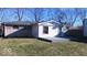 House exterior with gray brick and a deck at 868 N Raceway Rd, Indianapolis, IN 46234