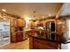 Eat-in kitchen, stainless steel appliances, and an island with seating at 868 N Raceway Rd, Indianapolis, IN 46234