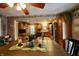 Kitchen features wood cabinets, stainless steel appliances, and a wood dining table at 868 N Raceway Rd, Indianapolis, IN 46234