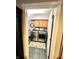 Laundry room with washer, dryer, cabinets, and tile floor at 868 N Raceway Rd, Indianapolis, IN 46234